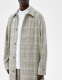 Karierter Trenchcoat